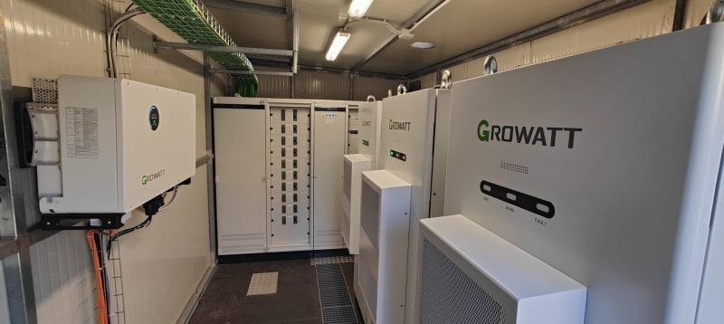 Wide electrical room view of Growatt WIT and AXE commercial storage retrofit
